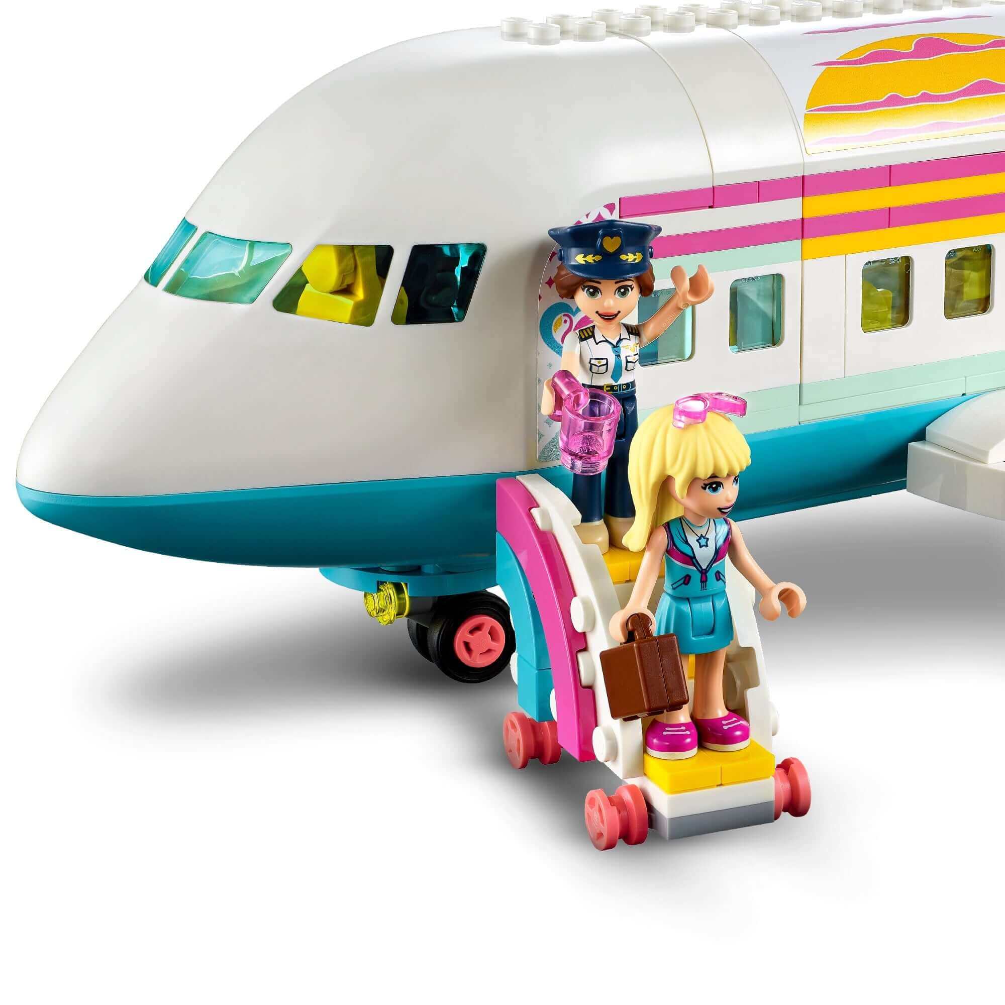 LEGO Friends Heartlake City Aeroplane Playset featuring two mini-dolls boarding a colorful airplane with boarding stairs.