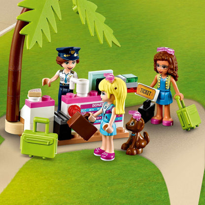 LEGO® Friends Heartlake City Aeroplane set featuring characters at a check-in desk with luggage and a dog.
