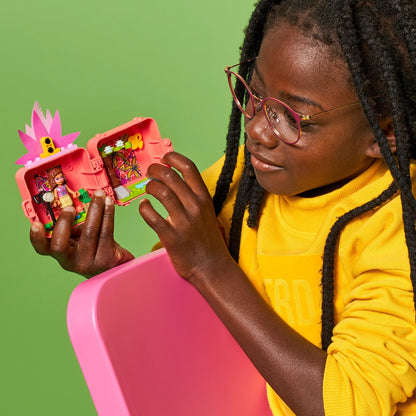 Child playing with LEGO® Friends Olivia's Flamingo Cube Mini Set 41662, showcasing creativity and animal fun.