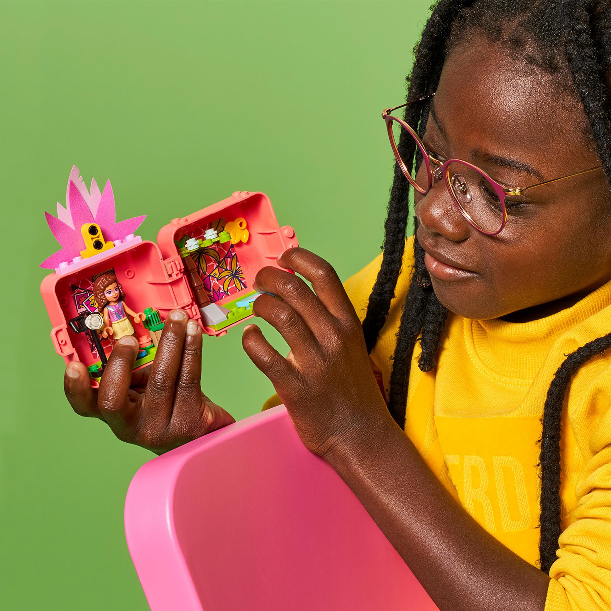 Child playing with LEGO® Friends Olivia’s Flamingo Cube Mini Set 41662, enjoying fun animal-themed adventures.