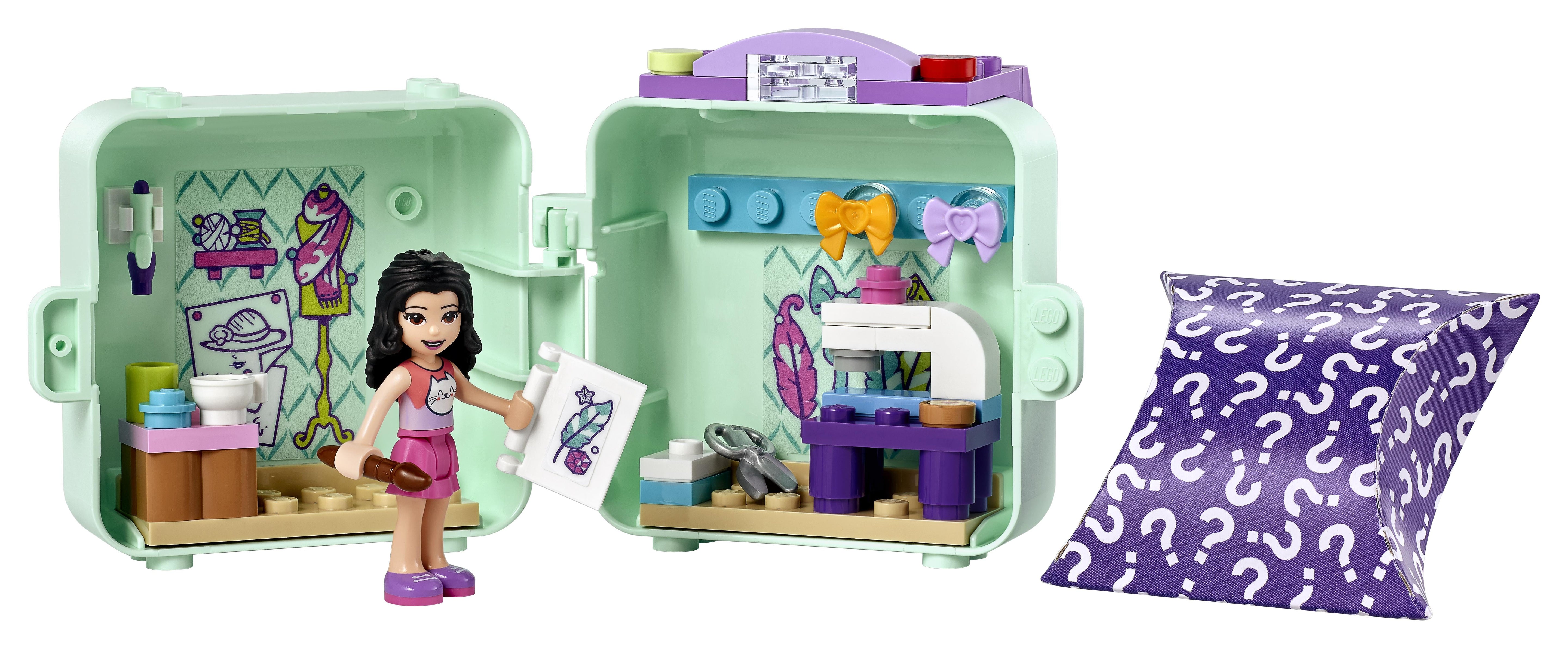 LEGO® Friends Emma’s Fashion Cube Play Set 41668 featuring Emma with sewing designs and accessories in a portable toy.