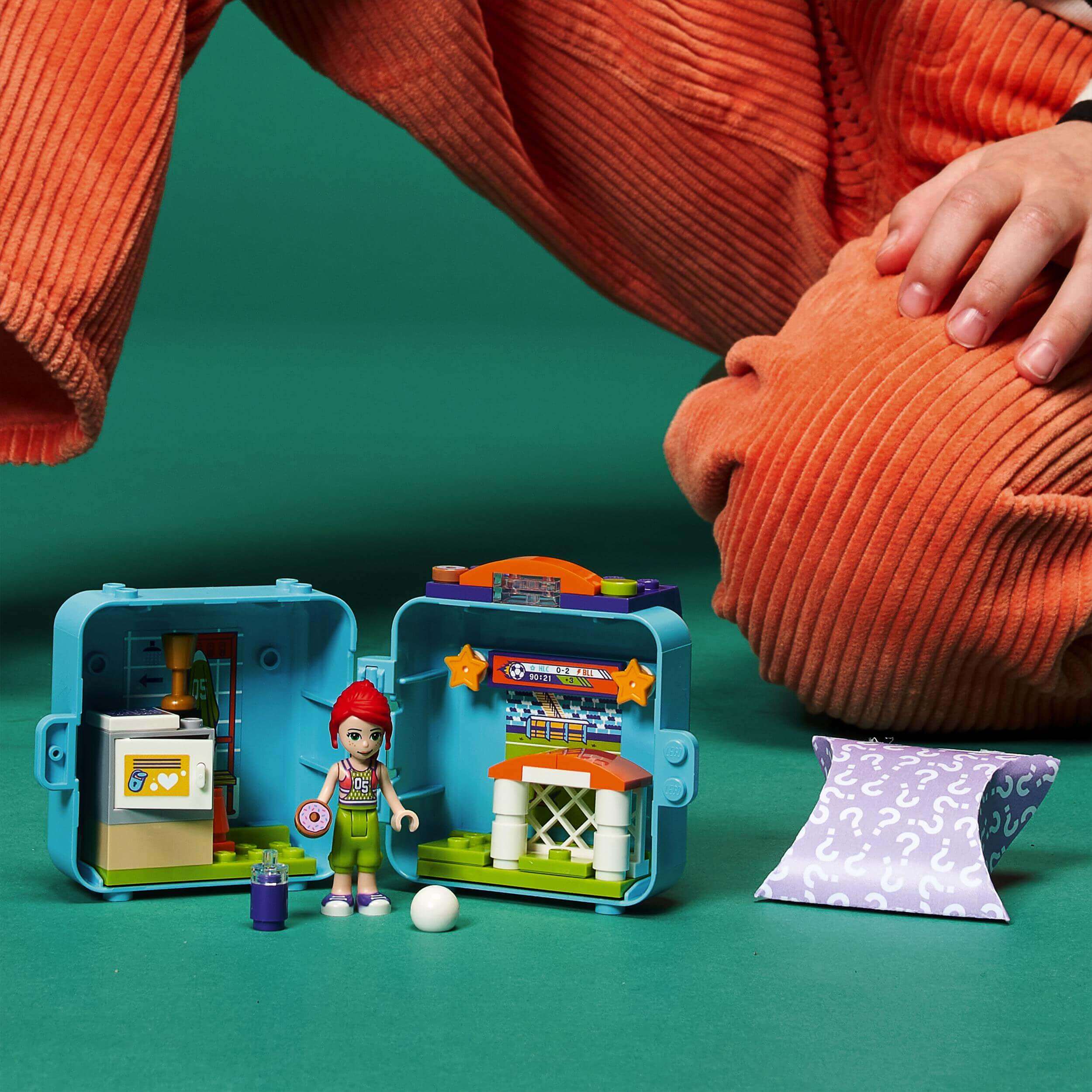 LEGO Friends Mia's Soccer Cube Play Set 41669 with a mini figure and soccer accessories for kids.
