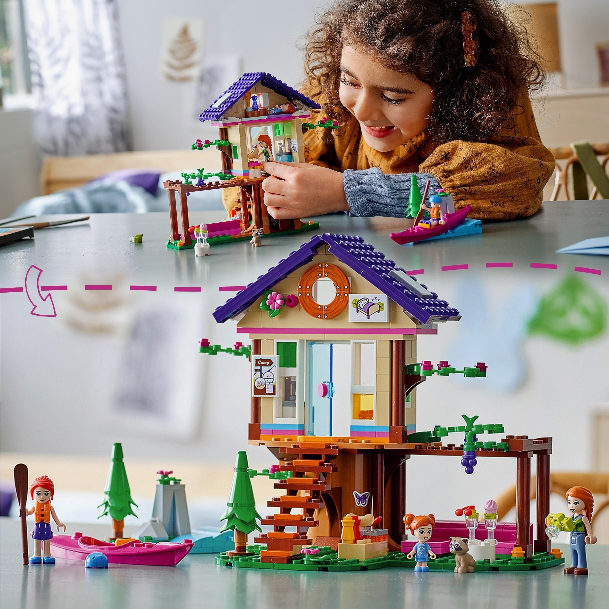 Child playing with LEGO Friends Forest House Treehouse Set 41679, enjoying nature-themed creative play.