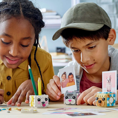 Kids creating fun animal picture holders with LEGO® DOTS set 41904, showcasing creativity and DIY play.