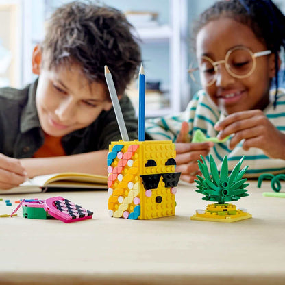 Kids enjoying the LEGO® DOTS Pineapple Pencil Holder Crafts Set, showcasing creativity and fun desk decor.