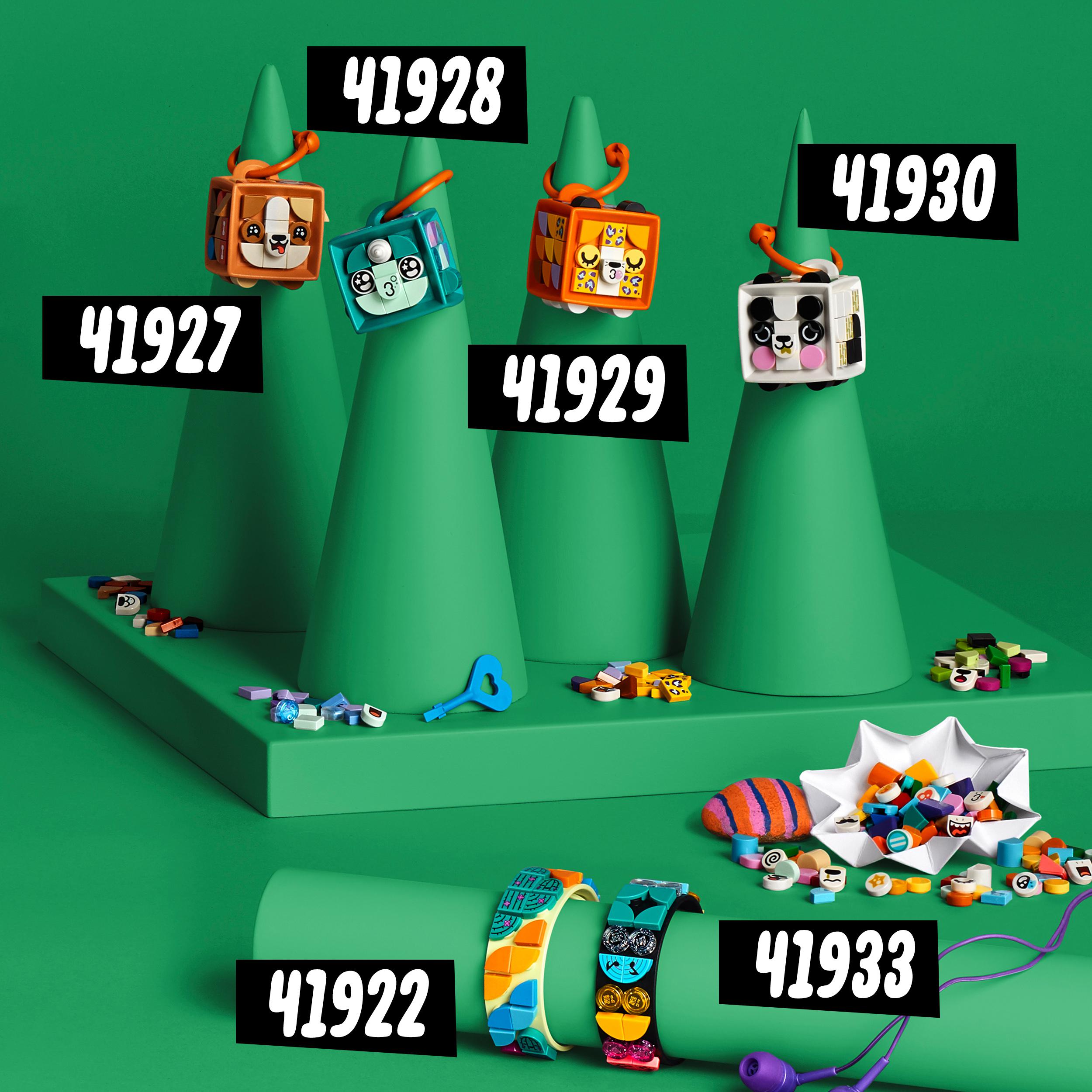 Colorful LEGO® DOTS crafts set featuring various decorated tiles on green background with multiple shapes and styles.
