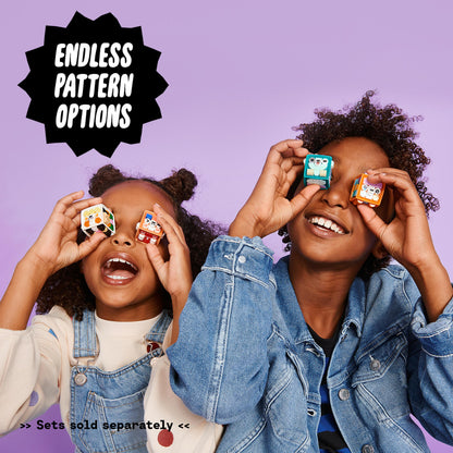 Two children holding LEGO DOTS tiles against a purple background, showcasing endless pattern options for crafting fun.