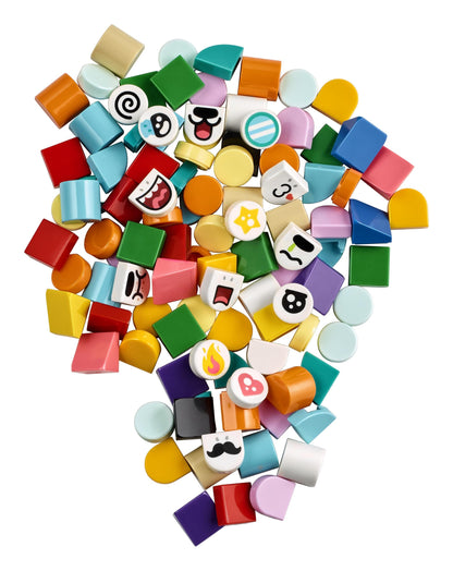 Colorful assortment of LEGO® DOTS tiles including facial expressions and mystery decorated tiles for creative crafts.