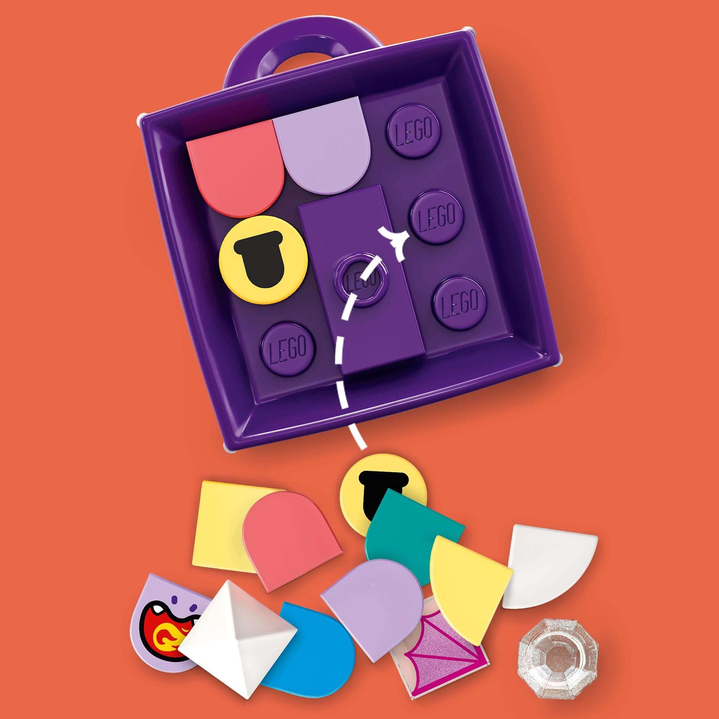 LEGO® DOTS Bag Tag Dragon Arts & Crafts Set 41939 with colorful tiles in a purple container, perfect for custom accessories.