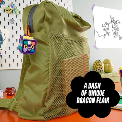 LEGO DOTS Bag Tag Dragon arts & crafts set adding unique flair to a green backpack, featuring customizable accessories and bright colors.