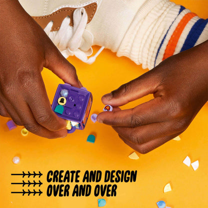 Child's hands crafting with LEGO® DOTS Bag Tag Dragon 41939, colorful tiles on a bright surface.