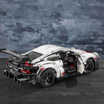 LEGO Technic Porsche 911 RSR model car kit with detailed engine and working features, showcasing realistic design.