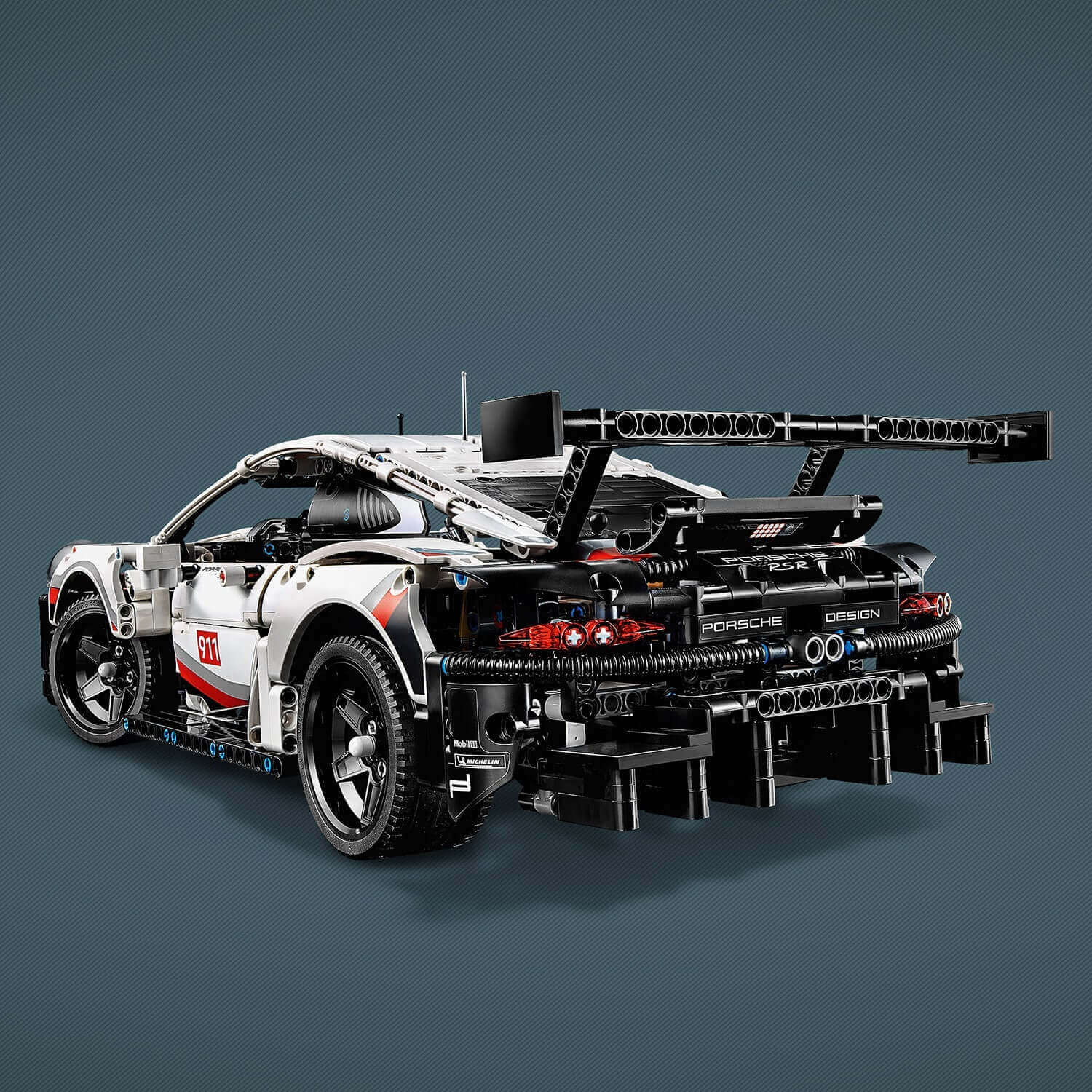 LEGO® Technic Porsche 911 RSR model car set 42096 showcasing realistic details and sleek design, including a rear view.