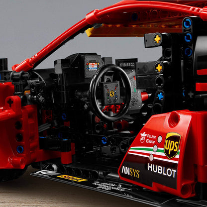 Interior detail of the LEGO Technic Ferrari 488 GTE model, showcasing dashboard and steering wheel features.