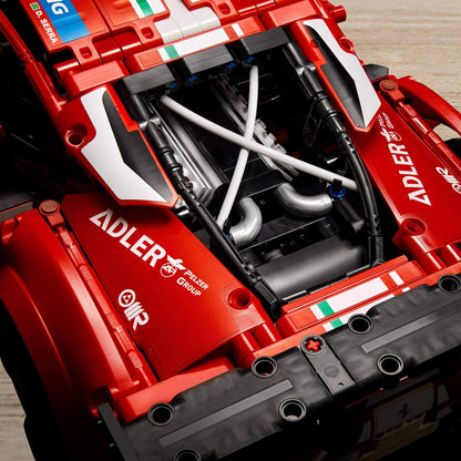 Detailed view of the engine of LEGO® Technic Ferrari 488 GTE AF Corse #51 Set 42125 model with red body and intricate components.