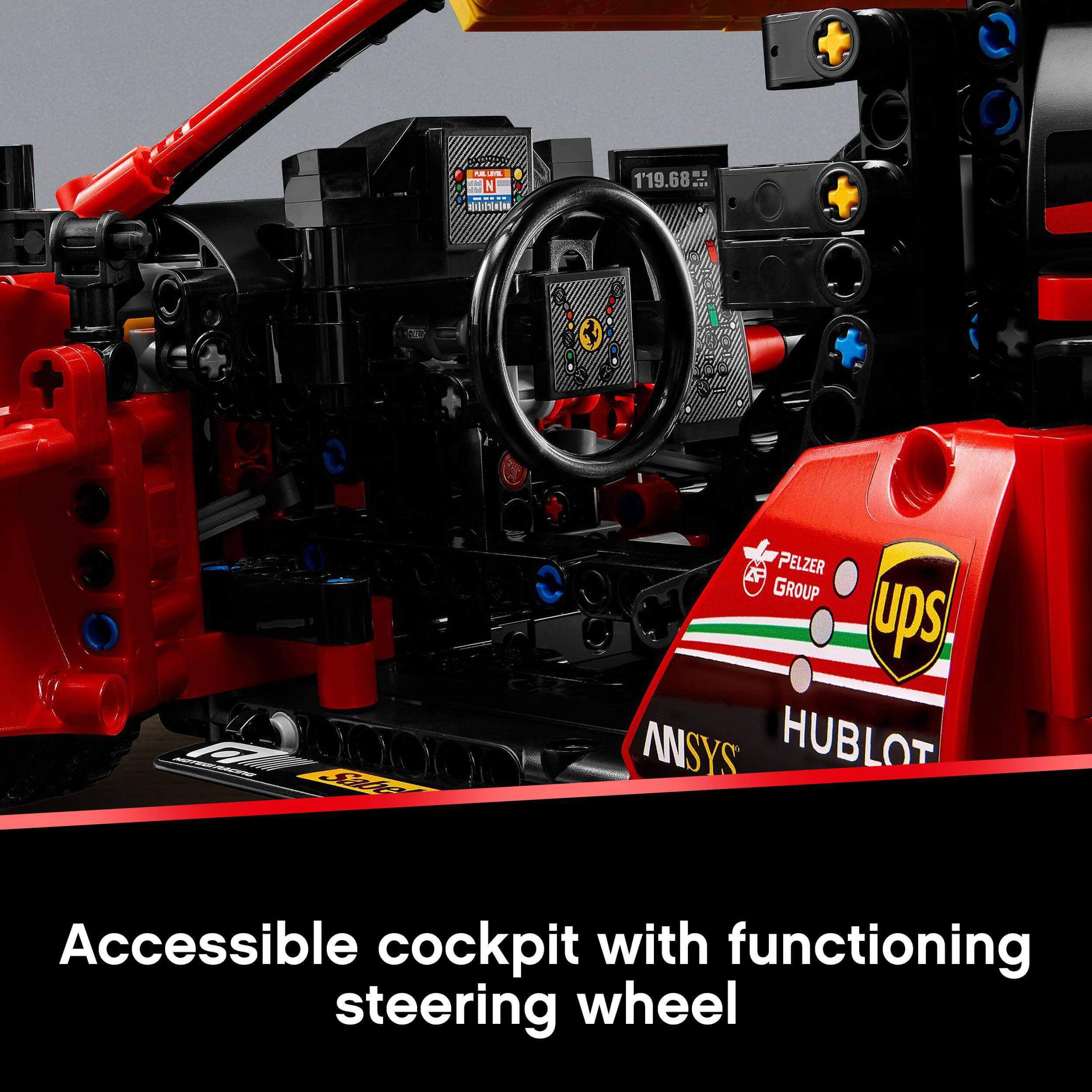 Close-up of LEGO Technic Ferrari 488 GTE cockpit showing functioning steering wheel and detailed interior.