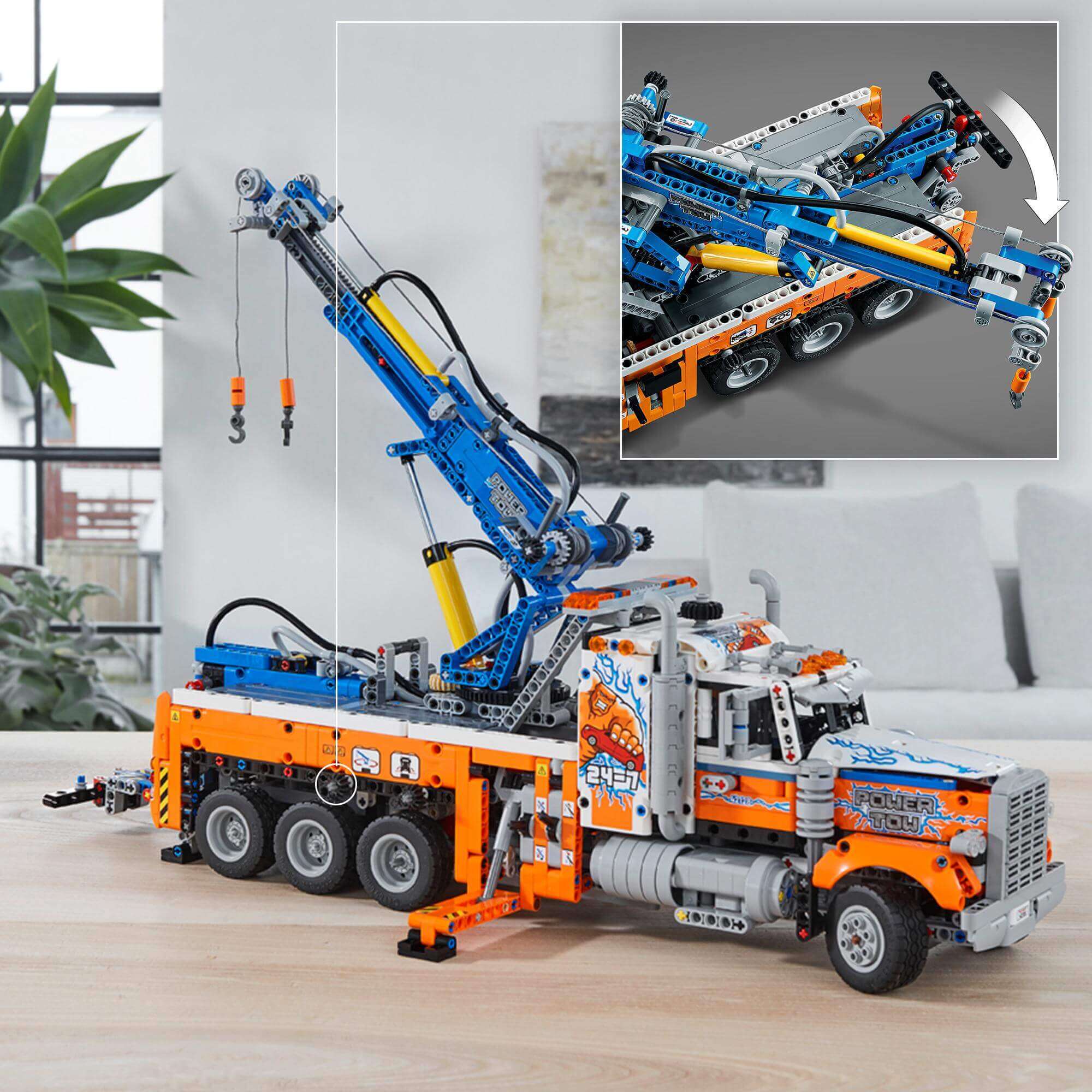 LEGO® Technic Heavy-Duty Tow Truck Toy 42128 with realistic design and detailed crane features.