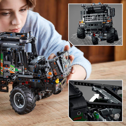 Child interacting with LEGO® Technic 4x4 Mercedes-Benz Zetros Truck, showcasing detailed model features.