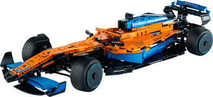 Highly detailed LEGO Technic McLaren Formula 1 Race Car model showcasing vibrant orange and blue design.