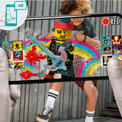 Child using a smartphone to create music videos with LEGO® VIDIYO Punk Pirate BeatBox set featuring colorful AR graphics.