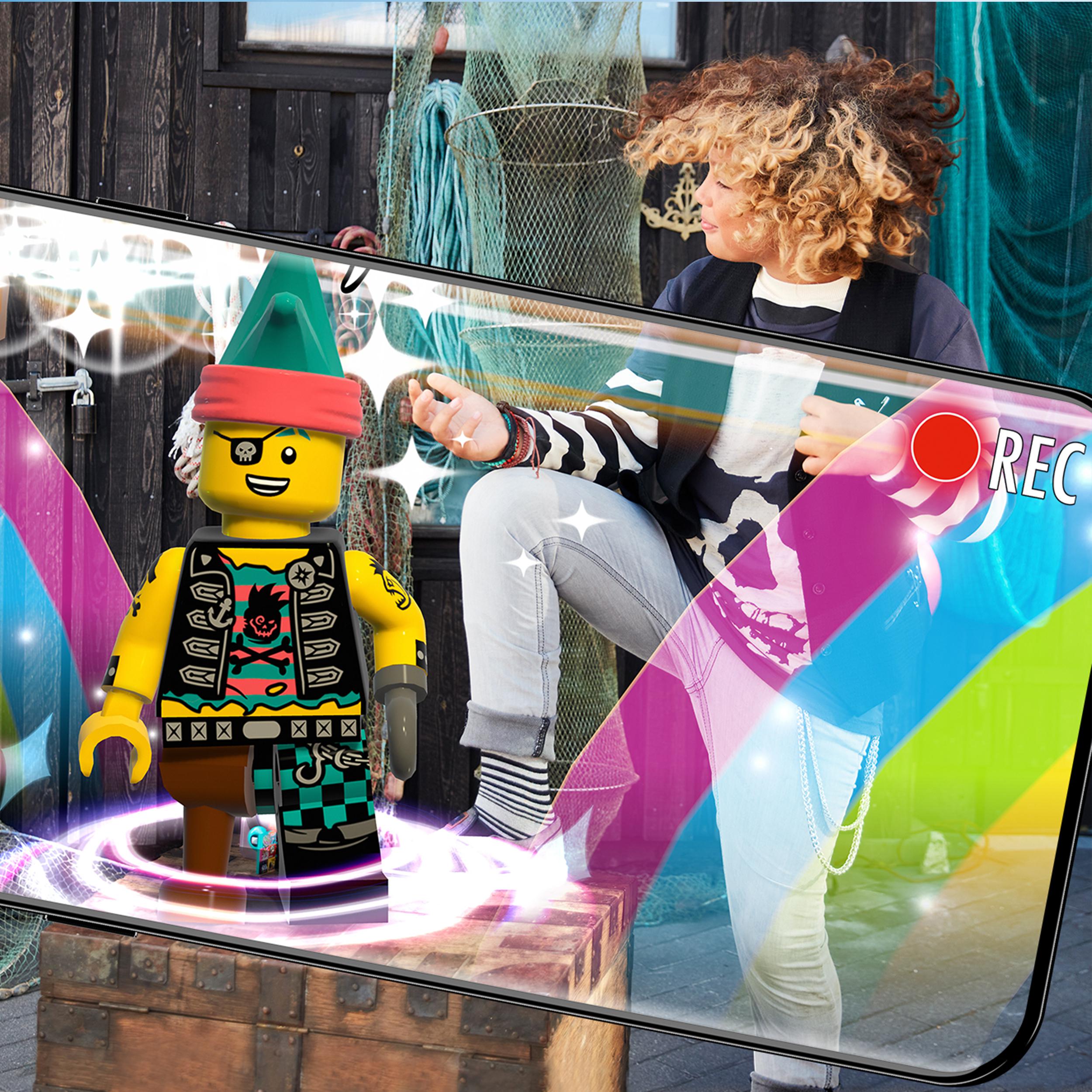 Child filming LEGO® VIDIYO Punk Pirate BeatBox music set with smartphone, showcasing creativity in music videos.