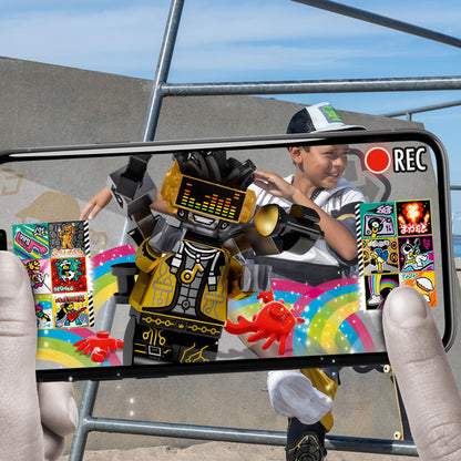 Child recording a music video with LEGO® VIDIYO HipHop Robot BeatBox set on a smartphone, showcasing creativity and fun.