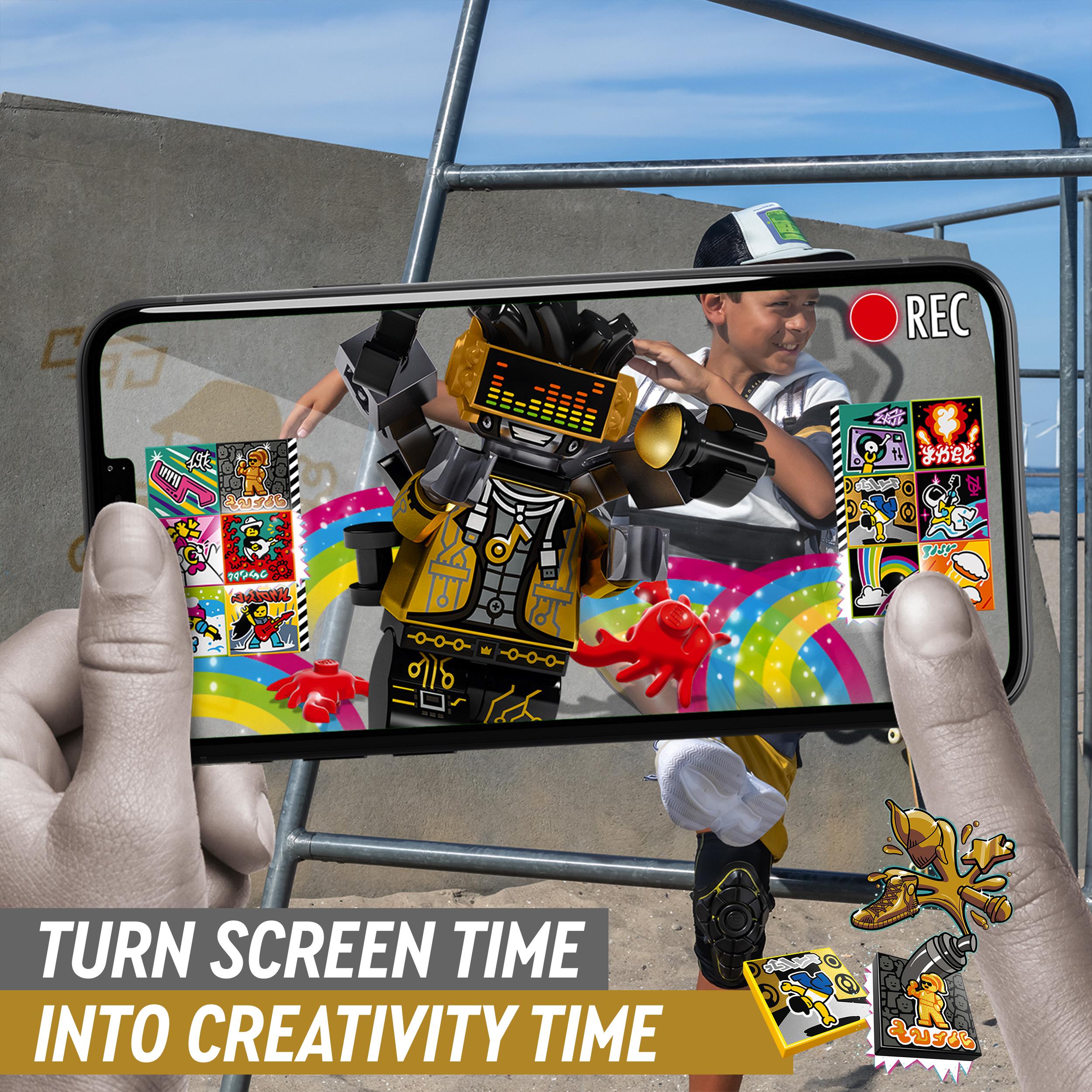 Child directing a music video using LEGO® VIDIYO HipHop Robot BeatBox set on a smartphone, showcasing creativity.