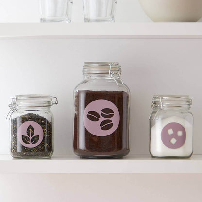 Glass jars with labels for coffee, tea, and sugar, decorated using Cricut Joy Smart Vinyl.