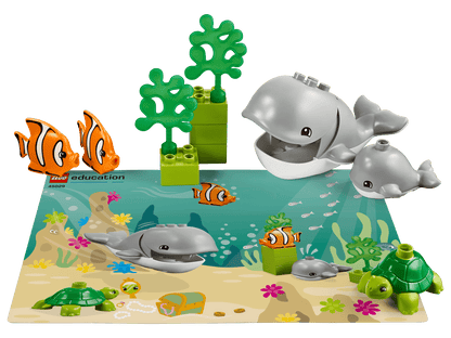 Colorful LEGO® Education Animals set featuring sea life: whales, clownfish, and turtles on an underwater scene.