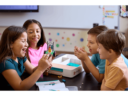 Children engaging with LEGO® Education Science kits in a classroom, fostering collaborative learning and curiosity.