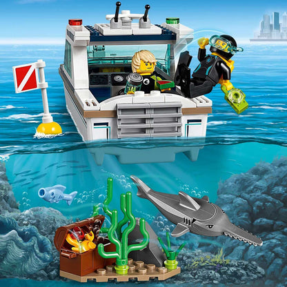 LEGO City Diving Yacht set 60221 with divers exploring underwater life and treasure in a vibrant ocean scene.