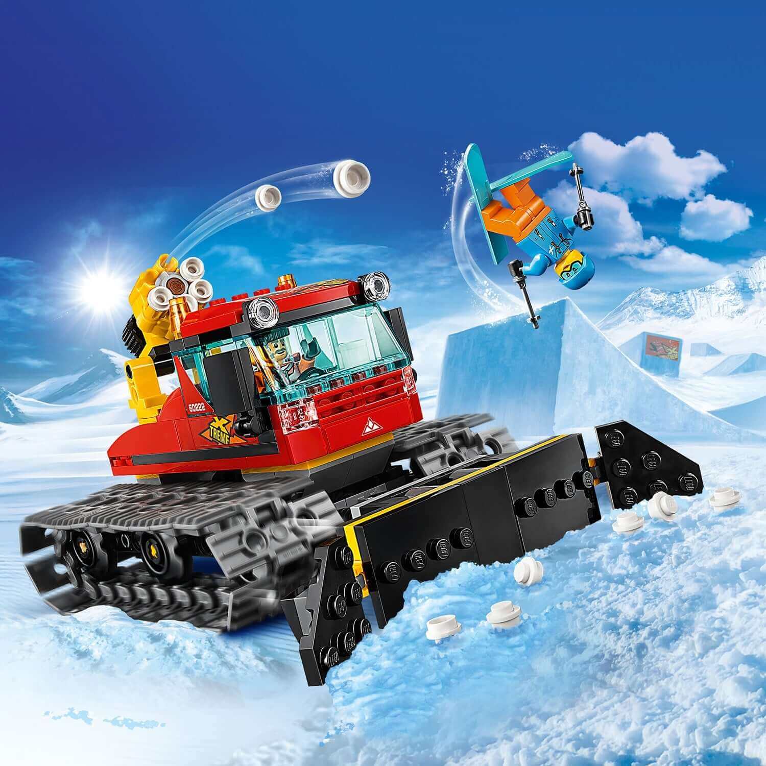 LEGO City Snow Groomer 60222 in action, clearing snow with a plough and a mini figure skiing.