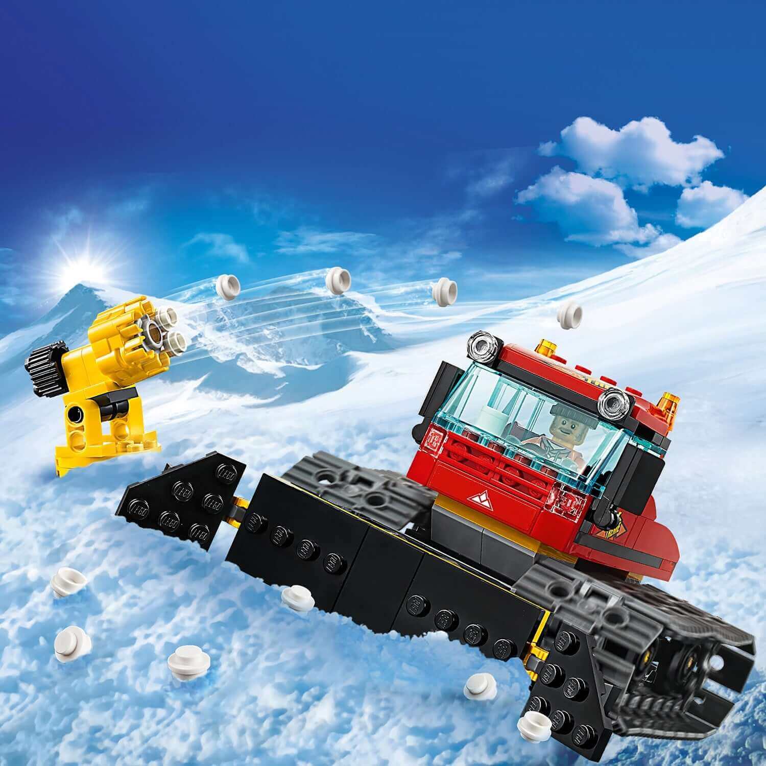 LEGO City Snow Groomer 60222 toy on snowy mountain, featuring plough and snow cannon for winter fun.