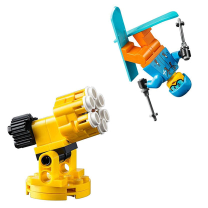 LEGO City Snow Groomer 60222 set featuring a snow cannon and a snowboarder in mid-air performing tricks.