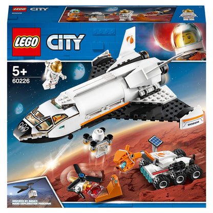 LEGO City Mars Research Shuttle 60226 playset with astronauts, rover, drone, and shuttle on a Martian landscape.