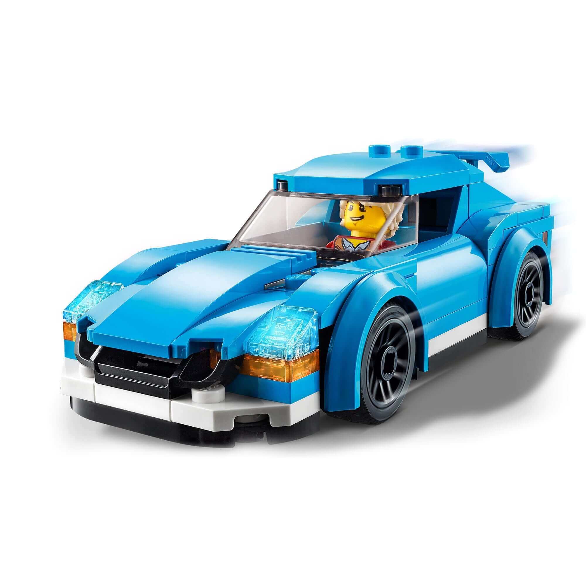LEGO® City Sports Car 60285 in blue with a minifigure driver, featuring a removable roof and sporty rims.