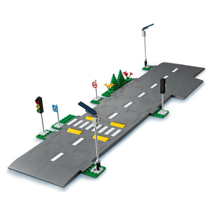 LEGO® City Road Plates building set 60304 with streetlights, traffic lights, road signs, and pedestrian crossing.
