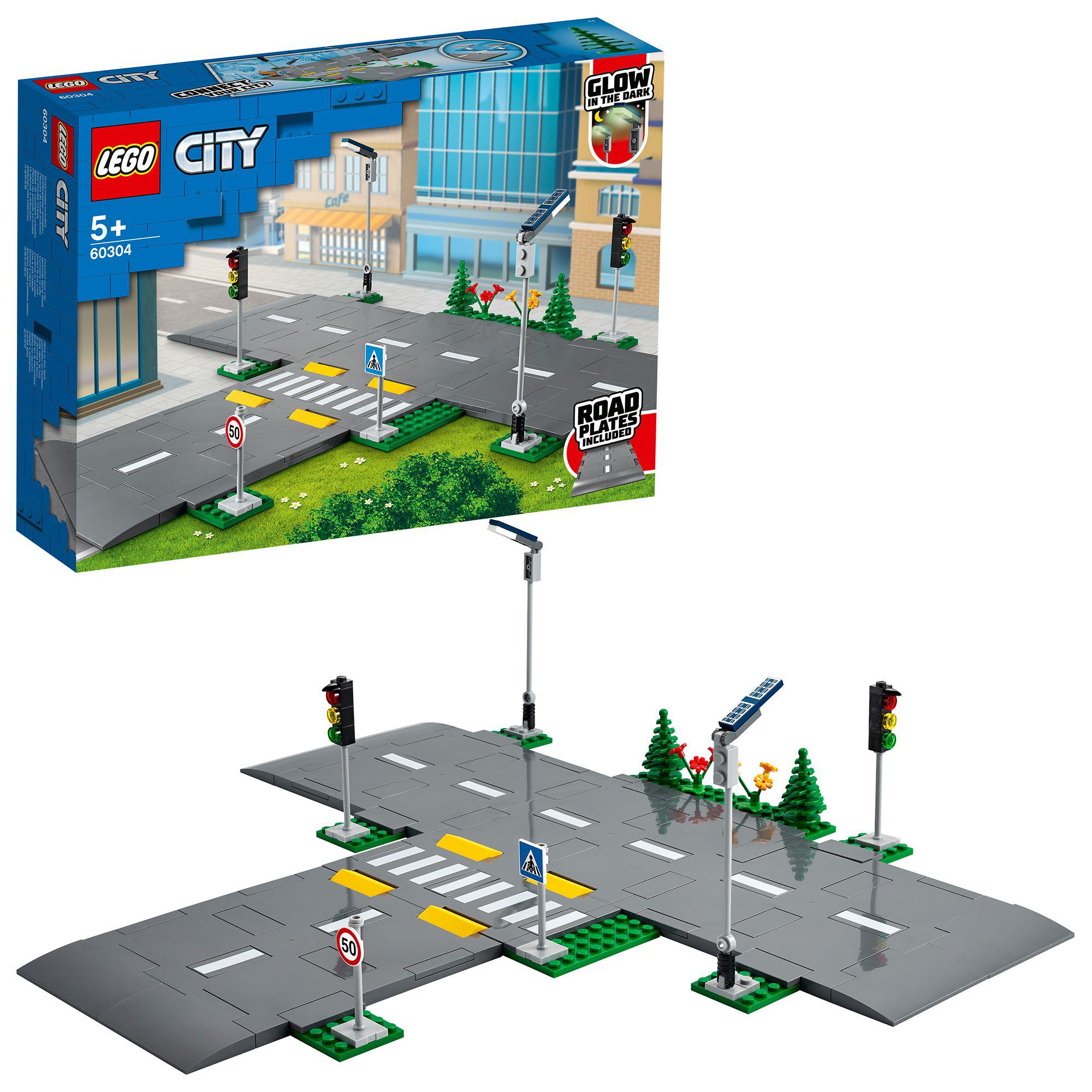 LEGO City Road Plates Set 60304 featuring road signs, traffic lights, and streetlights for kids aged 5 and up.