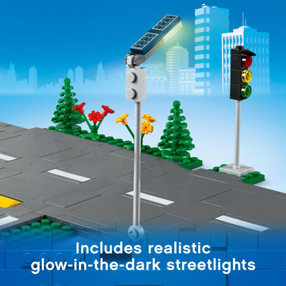 LEGO City Road Plates 60304 with glow-in-the-dark streetlights, traffic lights, and decorative plants.