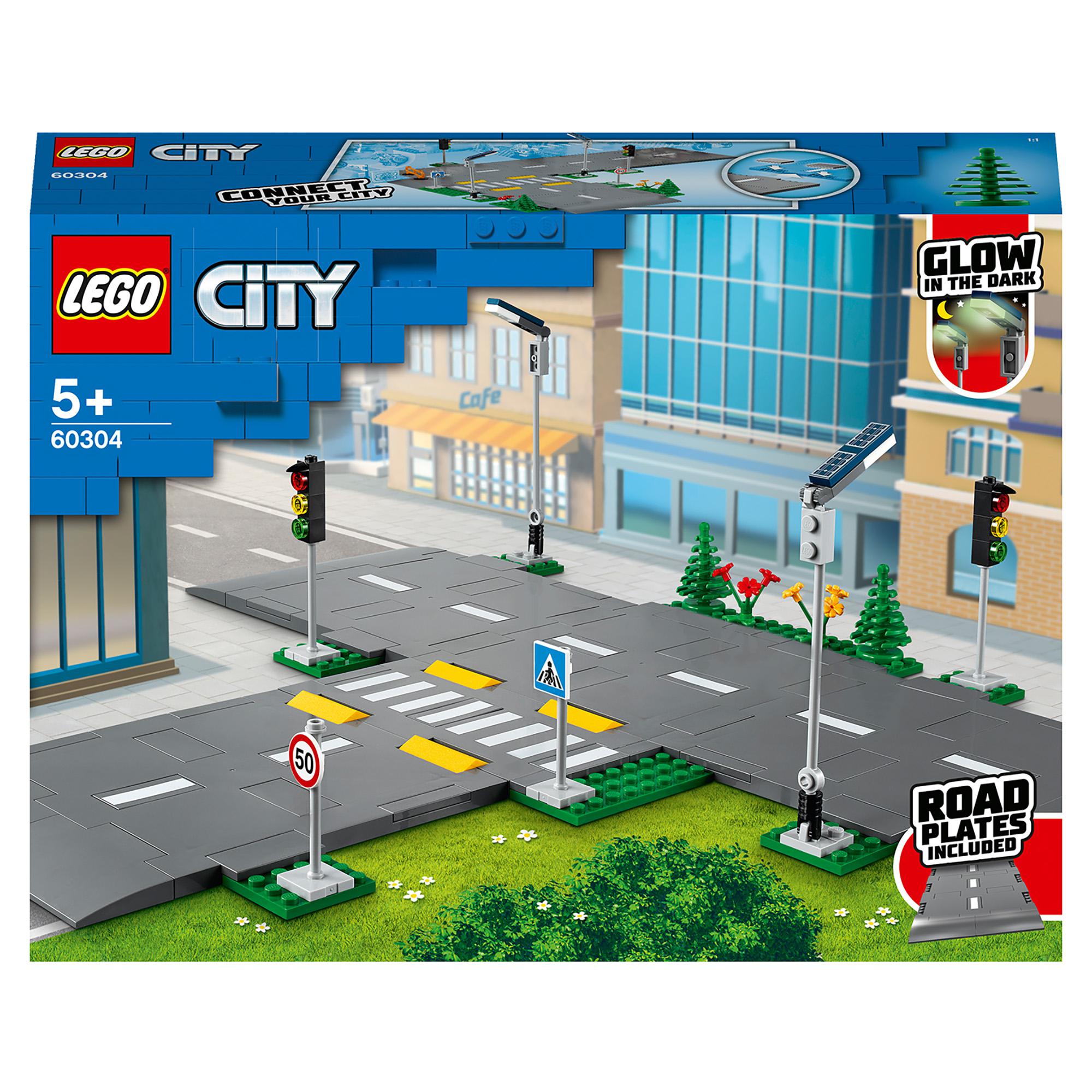 LEGO® City Road Plates Building Set 60304 with streetlights, traffic lights, and road signs for city expansion.
