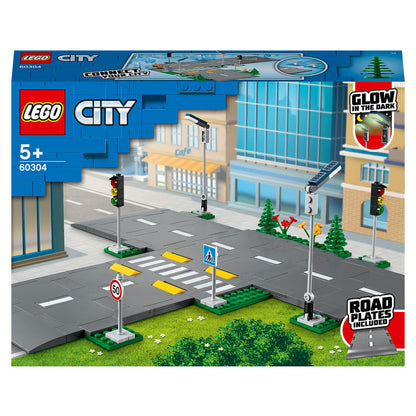 LEGO® City Road Plates Building Set 60304 with streetlights, traffic lights, and road signs for city expansion.