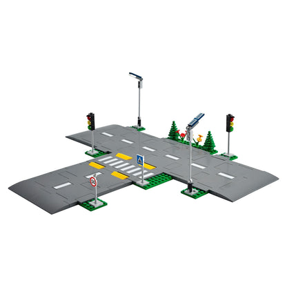 LEGO® City Road Plates Set 60304 featuring road signs, traffic lights, and pedestrian crosswalks for city building.