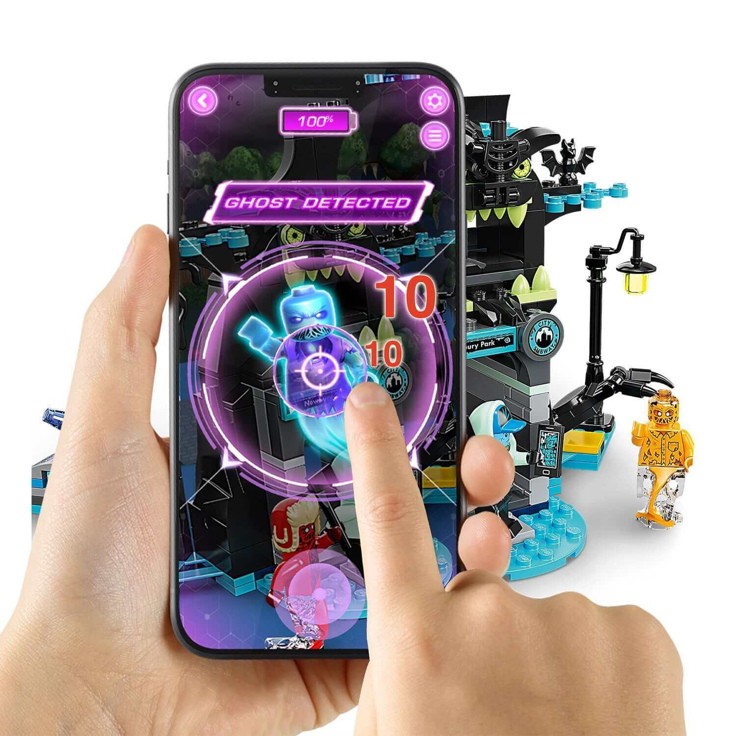 Child interacting with LEGO® Hidden Side AR app detecting a ghost, showcasing digital gameplay and physical LEGO® set.
