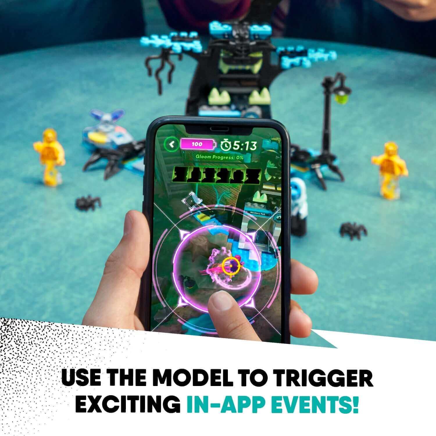 Child using LEGO® Hidden Side AR app to trigger in-app events with the 70427 set displayed on the table.