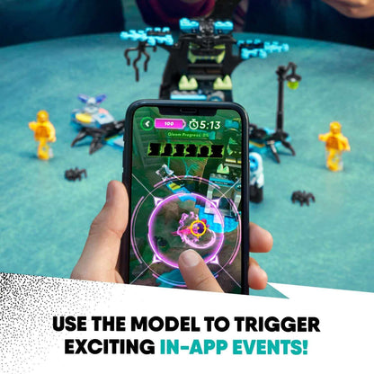 Child using LEGO® Hidden Side AR app to trigger in-app events with the 70427 set displayed on the table.