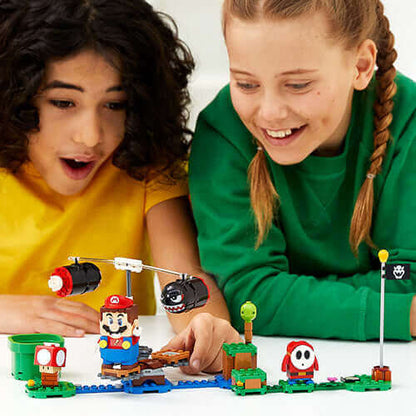Kids enjoying the LEGO® Super Mario™ Boomer Bill Barrage Expansion Set with Mario and friends.
