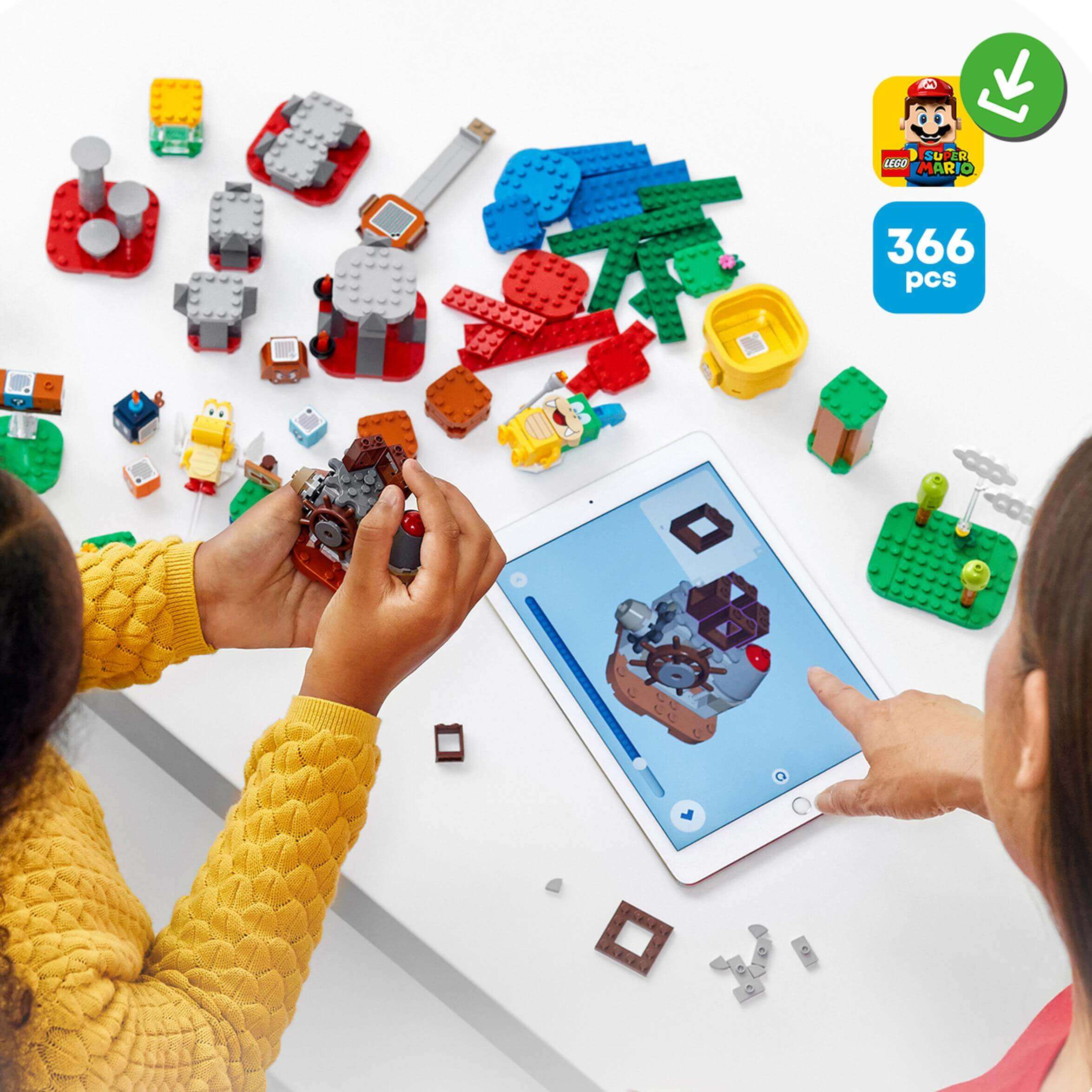 Kids building with LEGO® Super Mario Master Adventure Maker Set 71380, featuring interactive components and app enhancements.