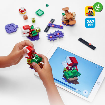 Child assembling LEGO® Super Mario Piranha Plant Expansion Set 71382 with an instruction tablet, featuring colorful pieces.