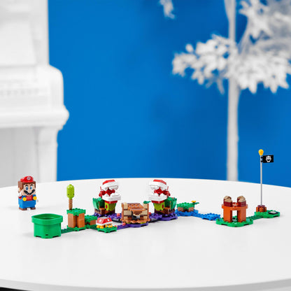 LEGO® Super Mario Piranha Plant Expansion Set 71382 displayed on a table with Mario figure and vibrant Soda Jungle elements.