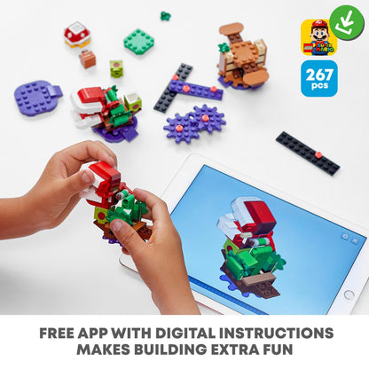 Child assembling LEGO® Super Mario Piranha Plant Expansion Set with digital app instructions.